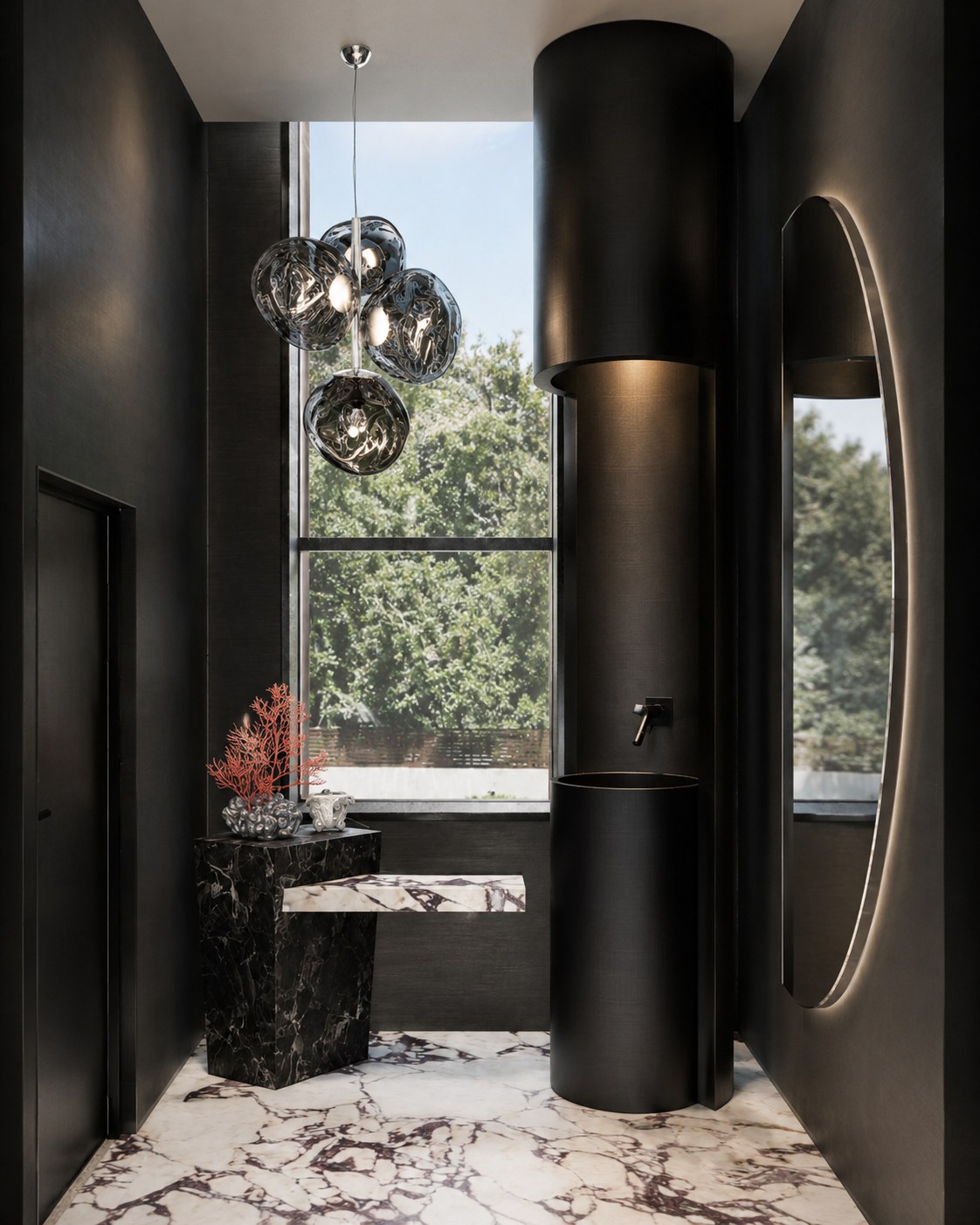 Black marble office bathroom, round mirror and sink